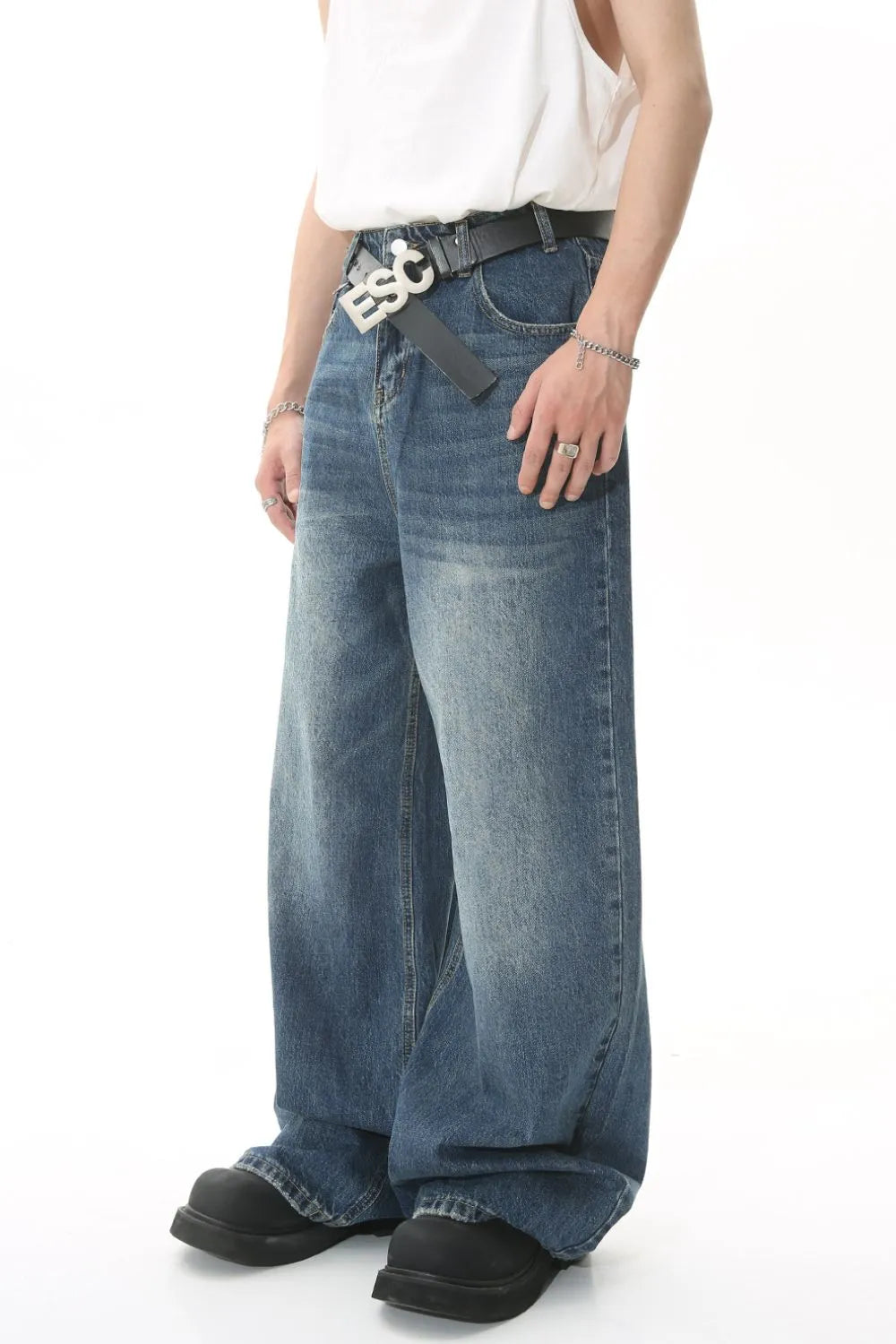 Wide leg jeans with pockets from Trendsi, featuring a relaxed fit and classic denim wash, shown on a model.
