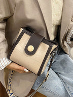 Crocodile embossed wide strap crossbody bag in premium PU leather with sleek design and spacious interior.