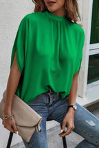 Elegant Trendsi tie-back half-sleeve blouse with side slit, featuring a stylish design and flowy fabric, perfect for casual or dressy wear.