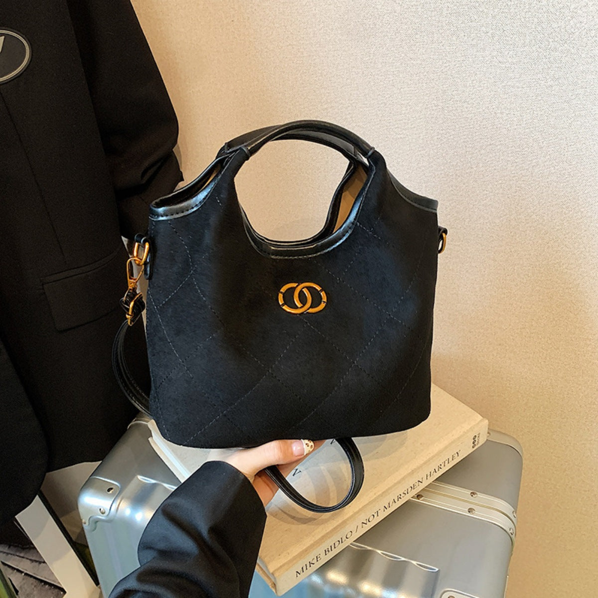 Luxurious suede medium top handle handbag by Trendsi featuring elegant design, shoulder strap, and spacious interior for everyday use.