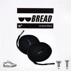 Sparkly black elastic shoelaces by Bread, designed for easy slip-on sneakers with a stylish, elastic fit.