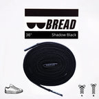 Black elastic shoelace by Bread, stylish and flexible for comfortable, slip-on sneakers or casual footwear.