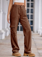 High-waisted cargo denim jeans by Plush Fashion Shop, featuring multiple pockets and a relaxed fit in classic blue denim.