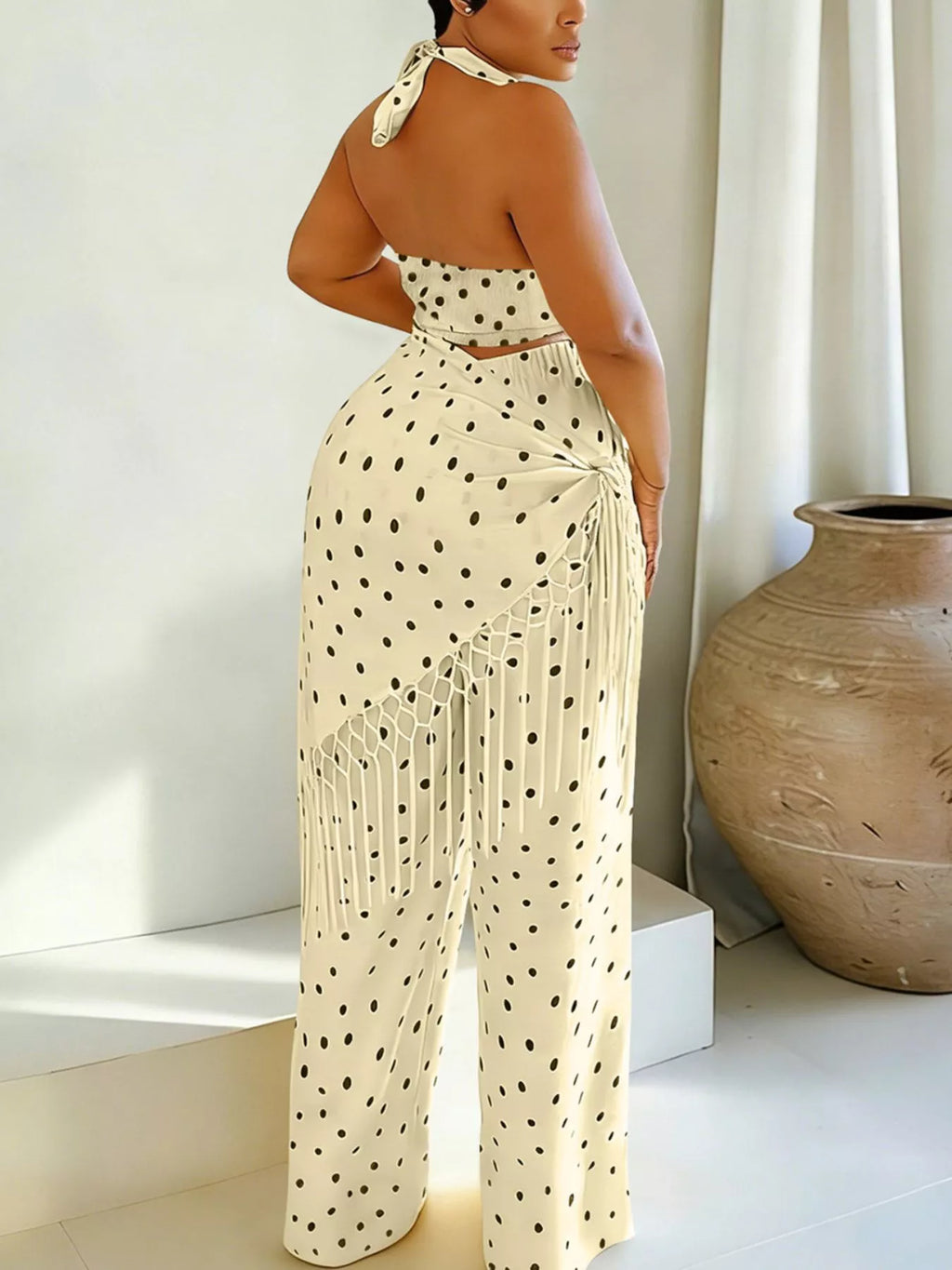 Polka dot halter neck cami with fringe trim pants set by Trendsi, featuring a stylish polka dot pattern and trendy design.