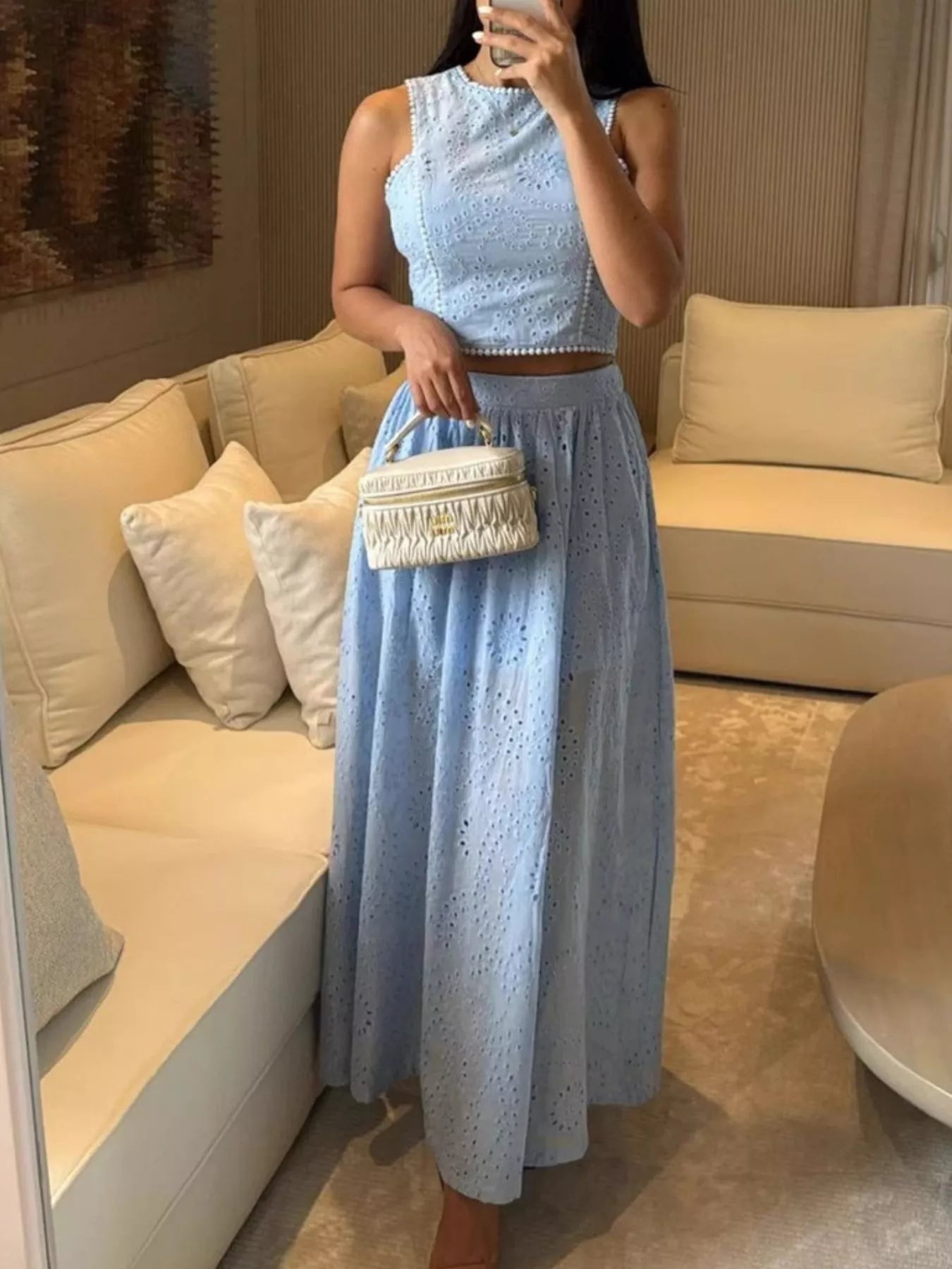 Trendsi eyelet crop top and maxi skirt set featuring a stylish crop top and flowing maxi skirt with eyelet details.