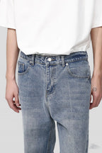 Light blue Plush Fashion Shop denim baggy jeans with large pockets and relaxed fit, displayed on a white background.