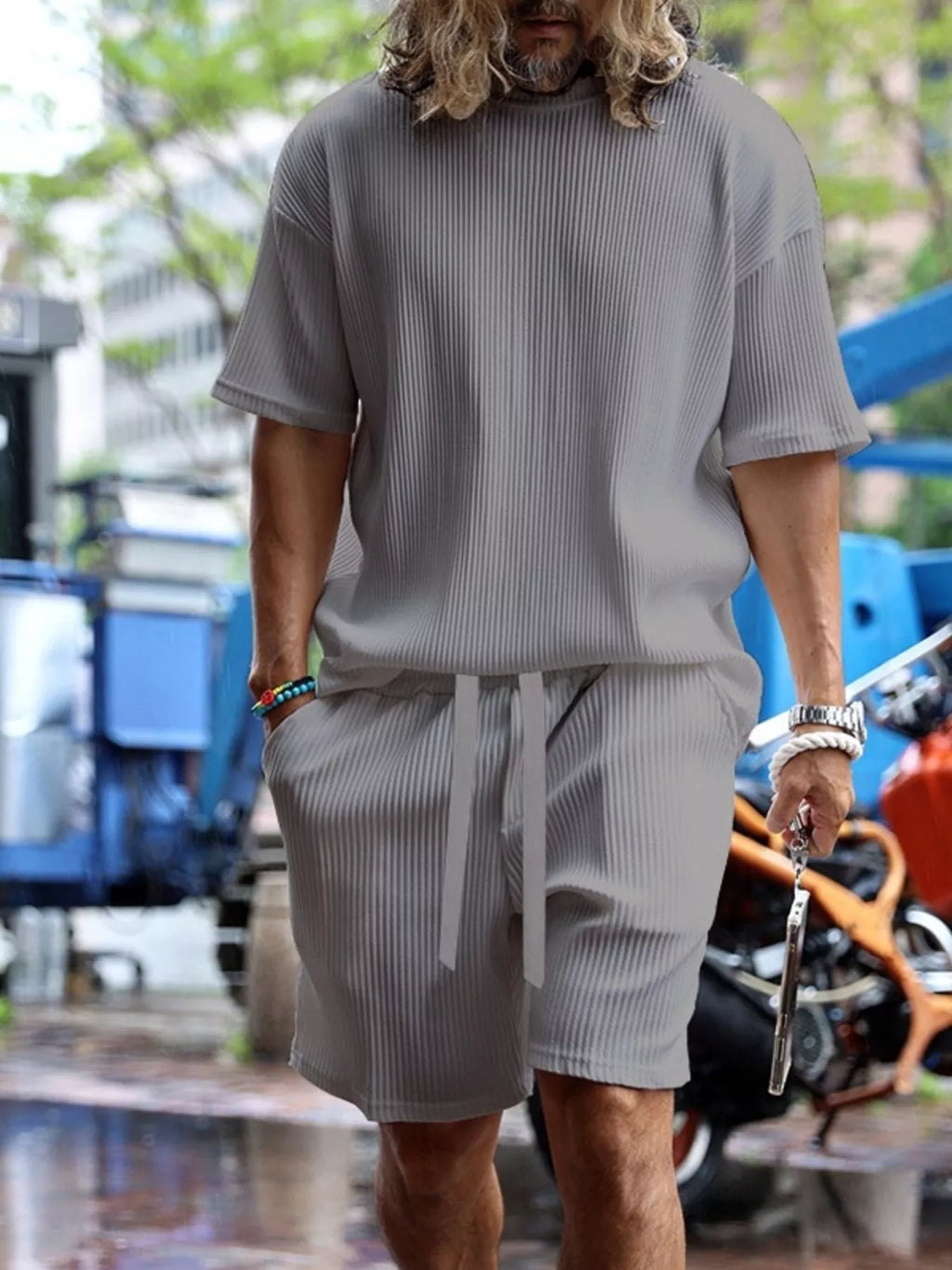 Plus size men's short sleeve top and shorts set by Trendsi, featuring a comfortable casual fit and coordinating design.
