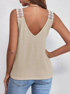 Women's waffle knit tank top with V-neck and delicate lace trim, stylish and comfortable women's tops by Trendsi.