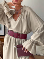 Cotton linen maxi dress with tie neck and flounce sleeves by Trendsi, featuring a flowing silhouette and casual elegant style.