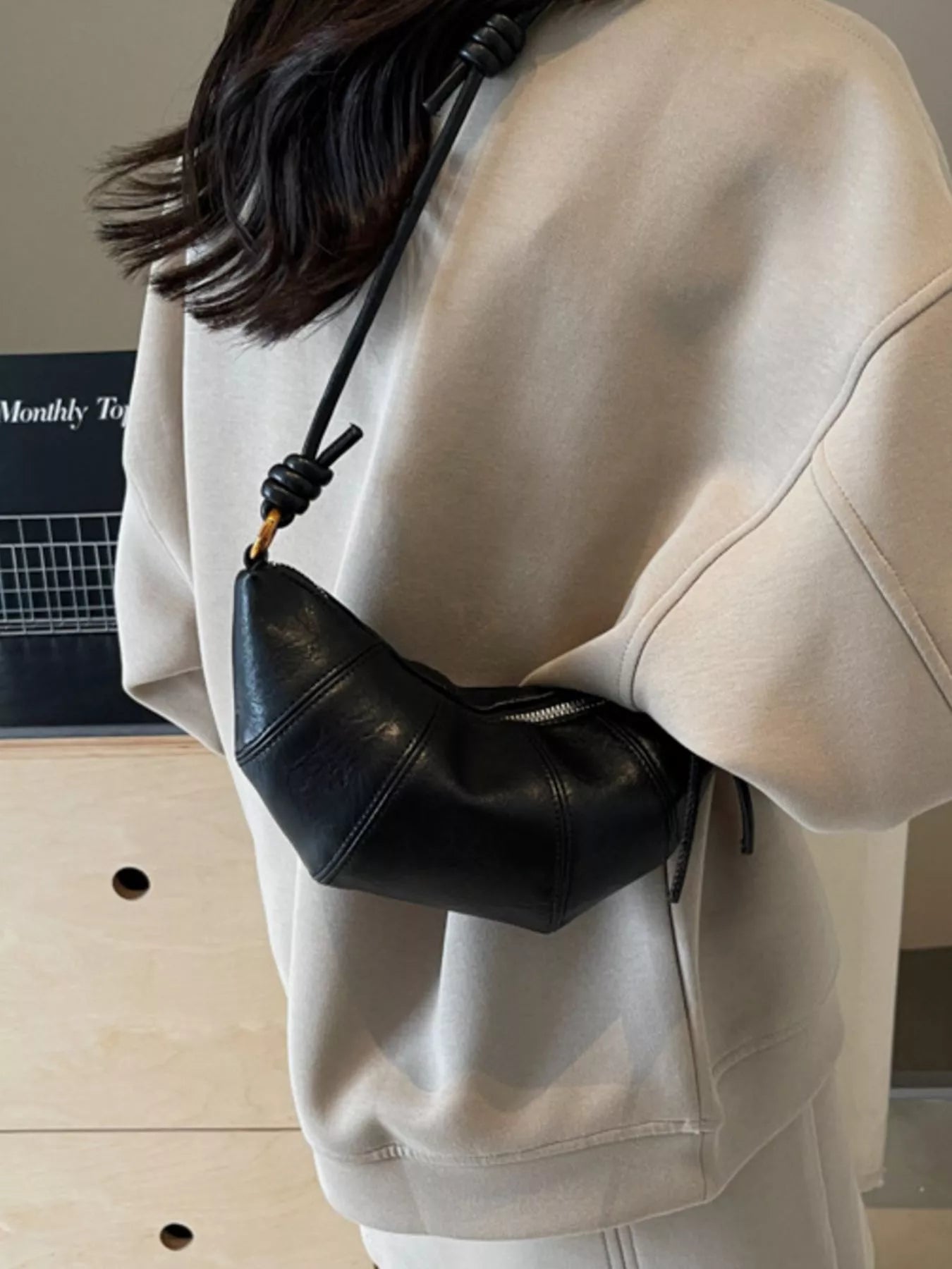 Croissant-shaped crossbody bag by Trendsi with a soft, pastry-inspired design and adjustable strap for stylish everyday wear.