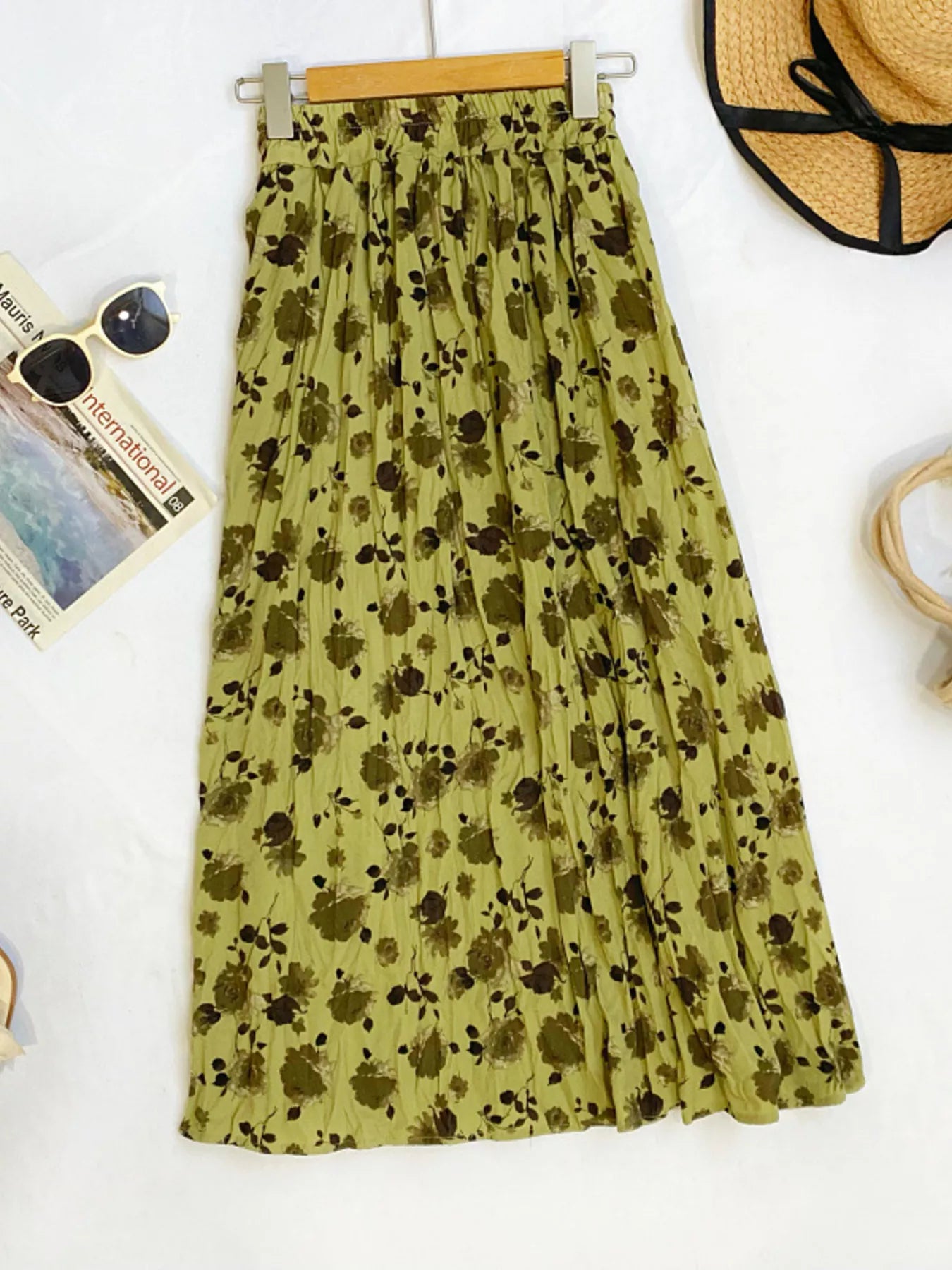 Floral print elastic waist midi skirt by Trendsi featuring a flowy design and vibrant floral patterns.