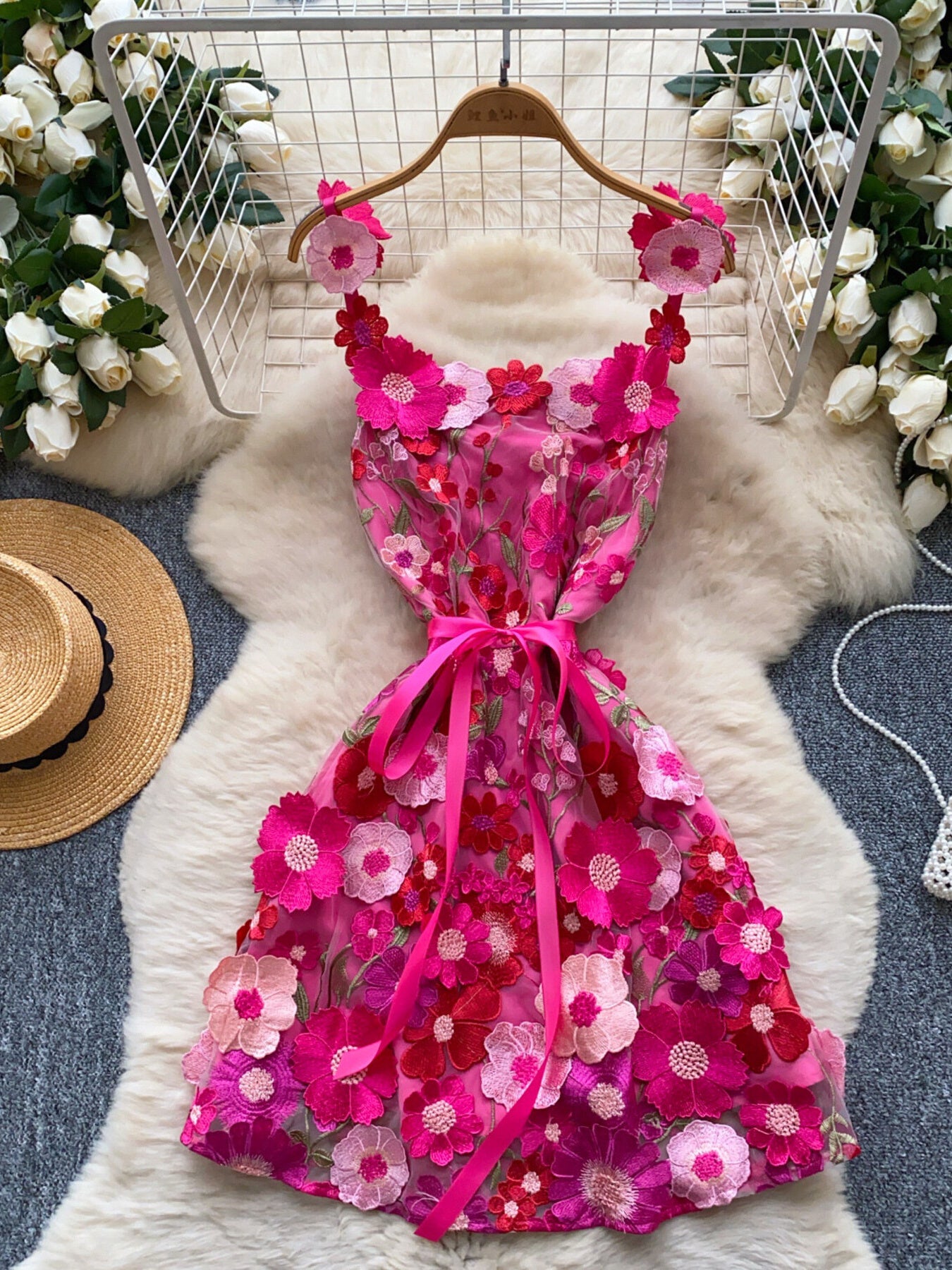 Floral embroidered tie waist mini dress by Trendsi, elegant summer A-line dress with floral embroidery and a flattering silhouette.