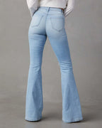 Distressed jeans with pockets from Trendsi, showing a casual fit with ripped details and functional front and back pockets.