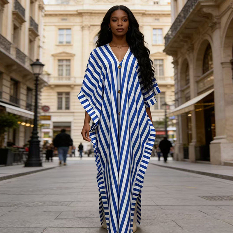 African-inspired striped loose long dress by FitiqueFit, featuring vibrant colors and a relaxed, flowing silhouette.