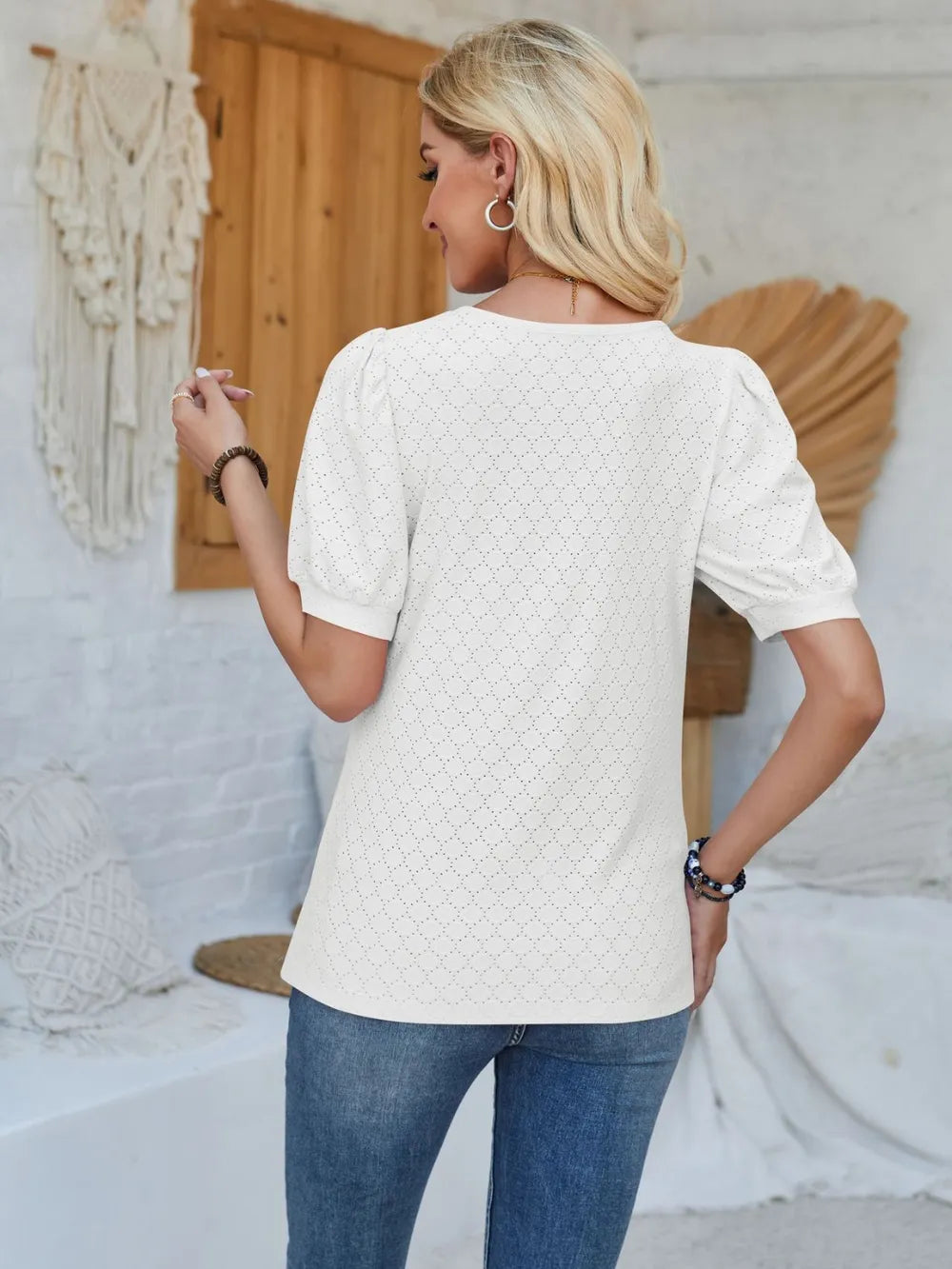 Light grey eyelet asymmetrical neck short sleeve T-shirt from Trendsi, featuring unique neckline and casual fit.