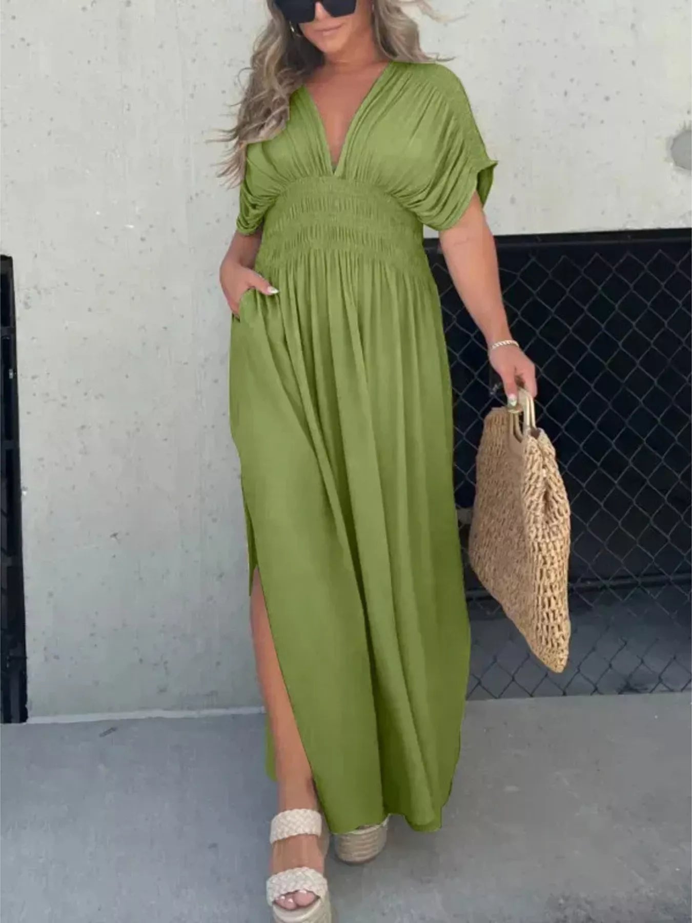 Full size slit V-neck smocked waist maxi dress by Trendsi, featuring a flowing silhouette and stylish design.