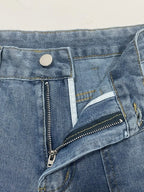 Distressed denim jeans with front and back pockets from Plush Fashion Shop, showcasing a casual, worn-in style.