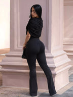 Ruched flare-leg jumpsuit from Trendsi featuring a fitted bodice and wide, flowing leg design in a stylish, modern look.