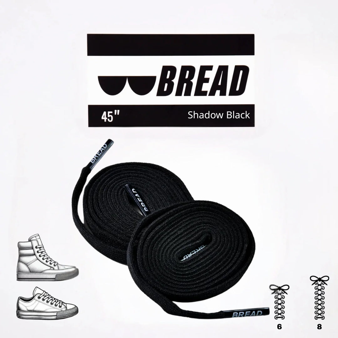 Sparkly black elastic shoelace from Bread's Shadow Black collection, featuring a shiny, flexible design for comfortable fit.