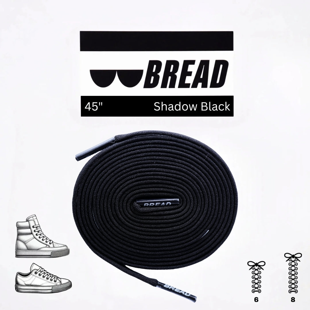 Black elastic shoelace by Bread, shown in classic style with aglets and flexible material for easy slip-on fit.