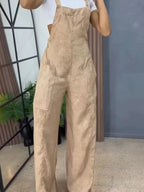 Full size wide leg denim overalls by Trendsi, featuring a one-piece design with adjustable straps and front pockets.