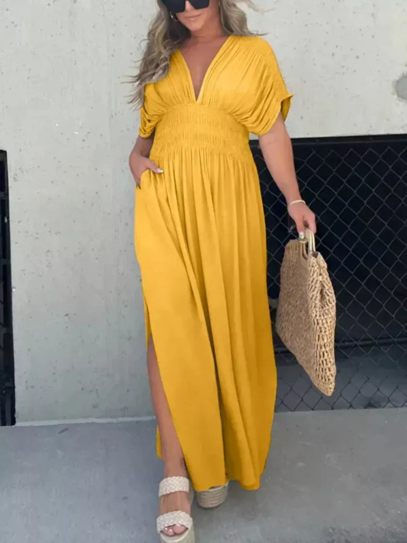 Plus size Maxi dress with slit, V-neck, smocked waist, by Trendsi, featuring flowy fabric and elegant design.