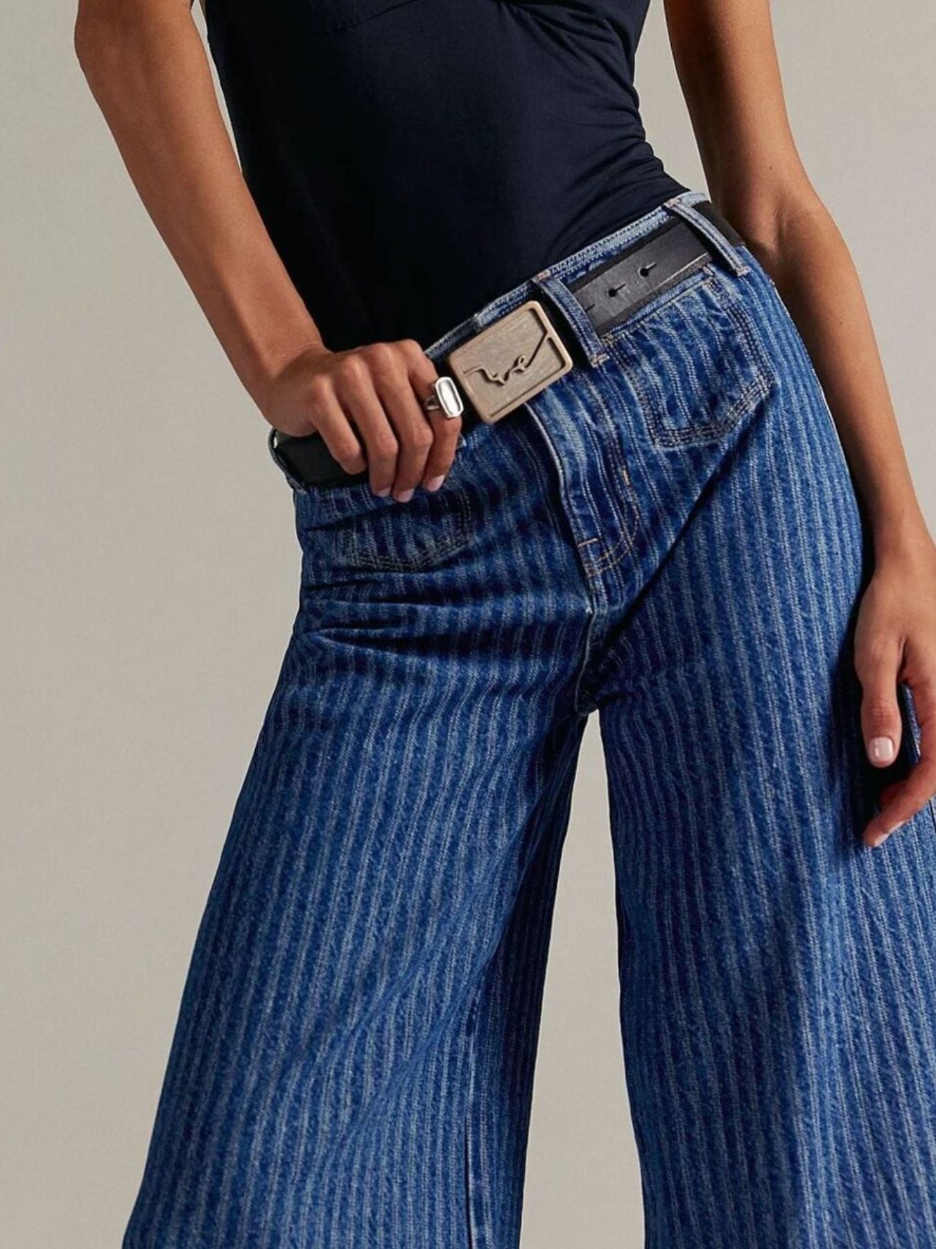 Light blue Plush Fashion Shop wide-leg cropped denim jeans with relaxed fit and frayed hem, displayed on a hanger.