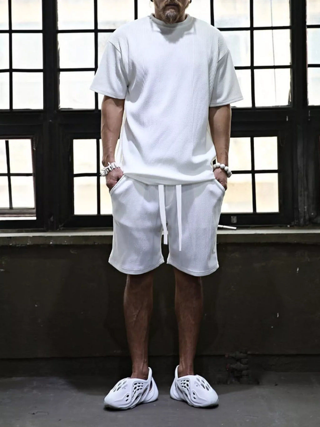 Plus size men's short sleeve top and shorts set by Trendsi, featuring a casual, comfortable fit with a coordinated matching design.