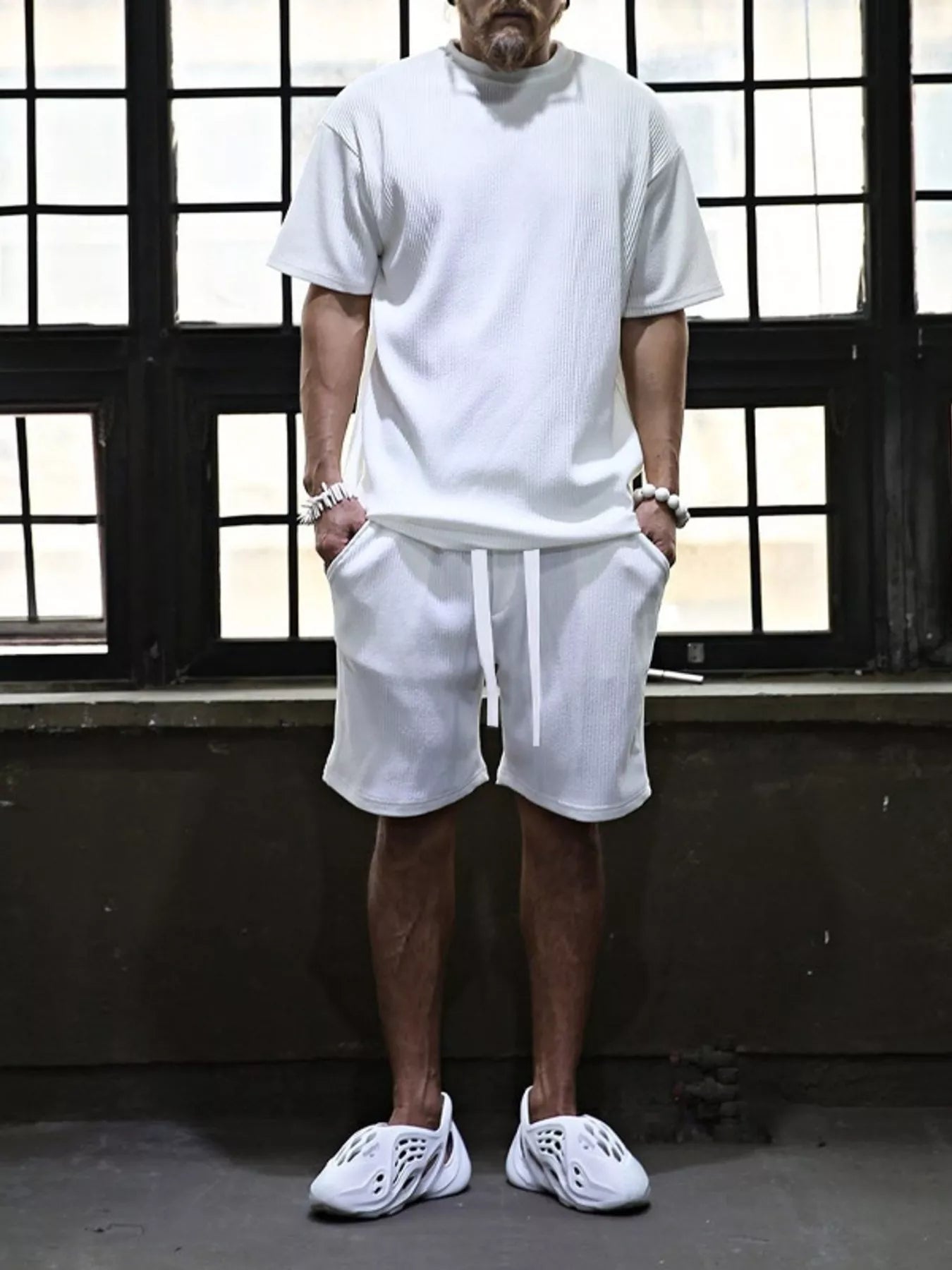 Plus size men's short sleeve top and shorts set by Trendsi, featuring a casual, comfortable fit with a coordinated matching design.