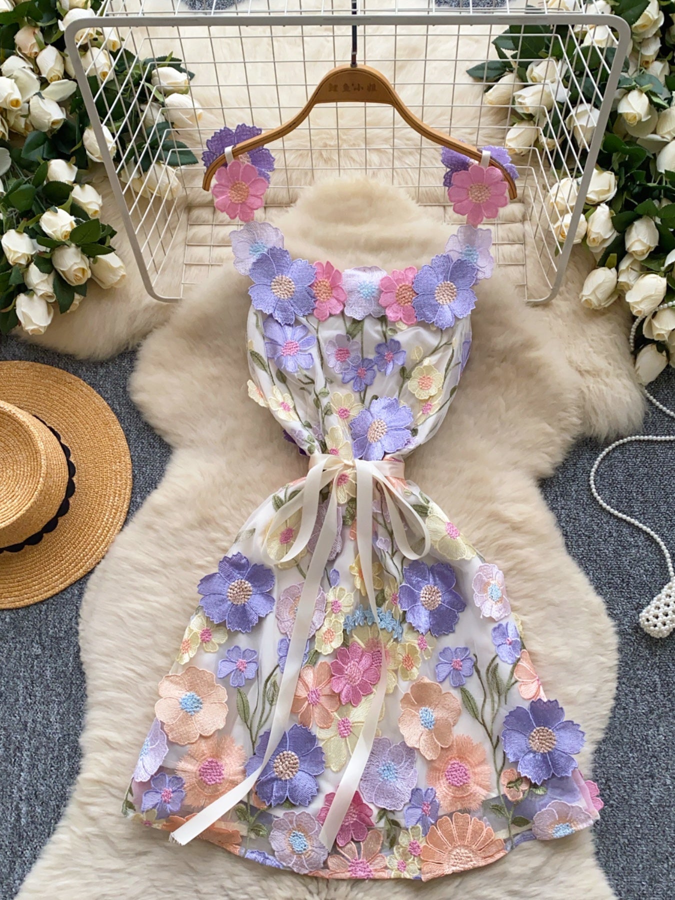 Floral embroidered tie waist mini dress from Trendsi featuring an elegant summer A-line silhouette and vibrant floral details.