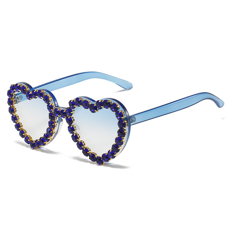 Peach heart-shaped rhinestone sunglasses in Y2K INS style, trendy eyewear by FitiqueFit with sparkling rhinestone details.