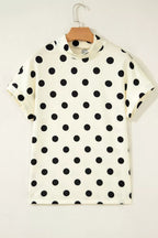 Polka dot print high neck dolman top from Trendsi, featuring a relaxed fit and stylish design with bold black and white dots.