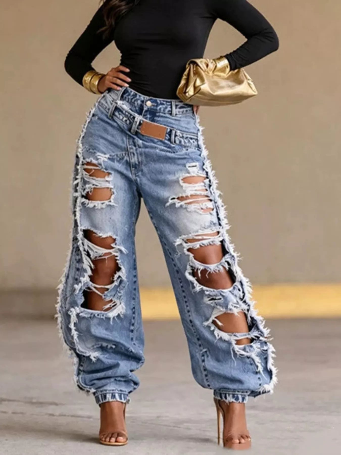 Distressed loose fit denim jeans by Plush Fashion Hub, showcasing a relaxed style with intentional rips and frayed hems.