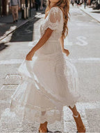Bohemian lace maxi dress by Trendsi featuring short sleeves, flowing silhouette, plus size, elegant design, and intricate lace details.