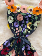 Floral embroidered tie waist mini dress by Trendsi, elegant summer A-line dress with colorful floral patterns and a flattering fit.
