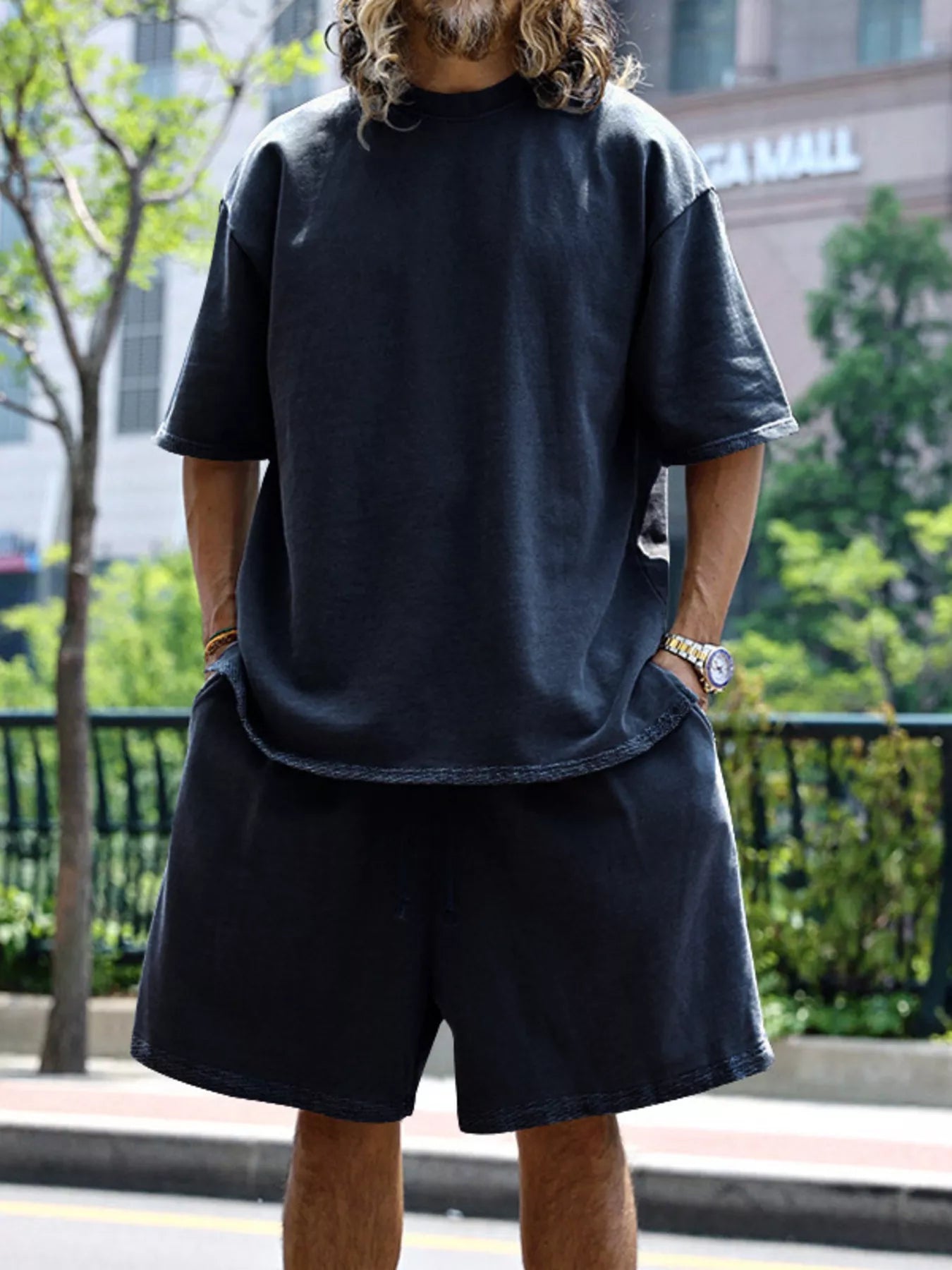 Plus size men's relaxed fit T-shirt and shorts set by Trendsi, featuring comfortable casual fit and soft fabric.