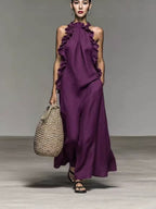 Flowy FitiqueFit halter neck sleeveless dress with ruffles, loose fit, and pockets, ideal for casualwear and warm weather.