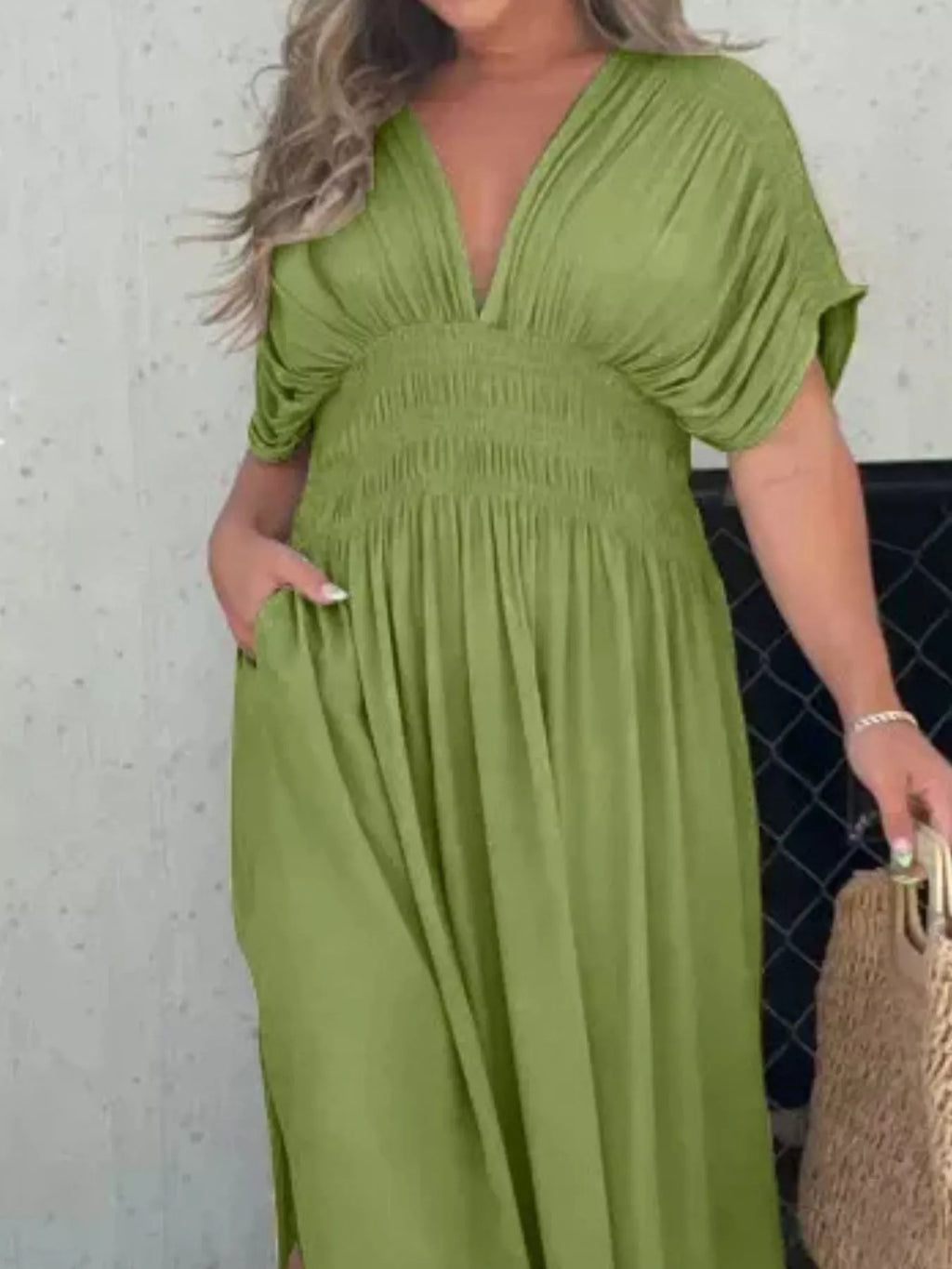 Full size slit V-neck smocked waist maxi dress by Trendsi, showcasing flowing fabric, V-neckline, and smocked waist detail.