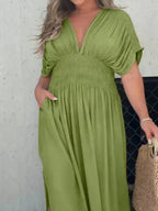 Full size slit V-neck smocked waist maxi dress by Trendsi, showcasing flowing fabric, V-neckline, and smocked waist detail.