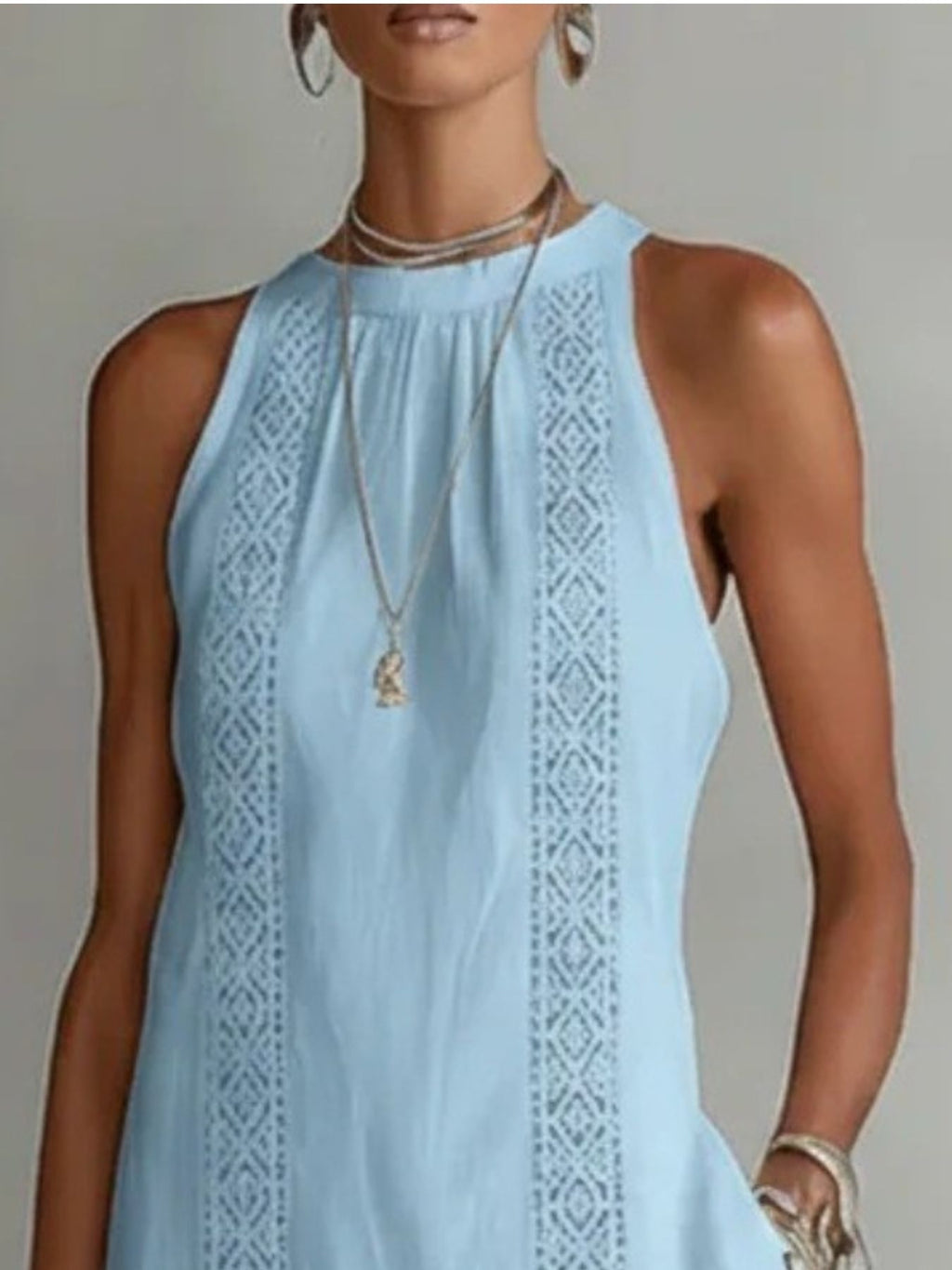 Sleeveless hollow-out midi dress with side slit and pockets from Trendsi, featuring a stylish cut and breathable fabric.