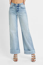 Stretchy high-rise ankle jeans with wide cuffs and tummy control from Plush Fashion Hub, shown in dark denim fabric.