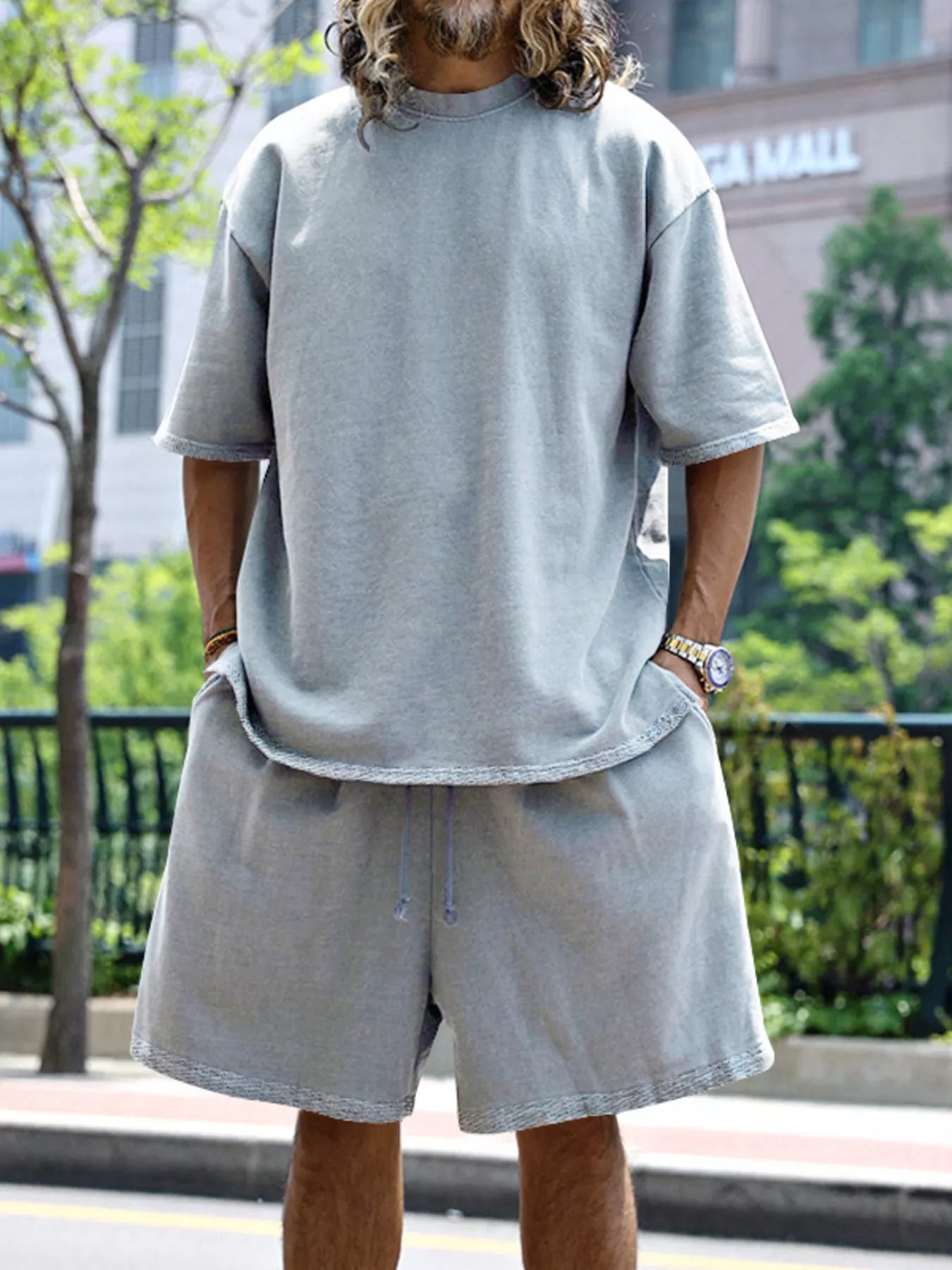 Plus size men's relaxed fit T-shirt and shorts set by Trendsi, featuring comfortable casual wear in a full size.