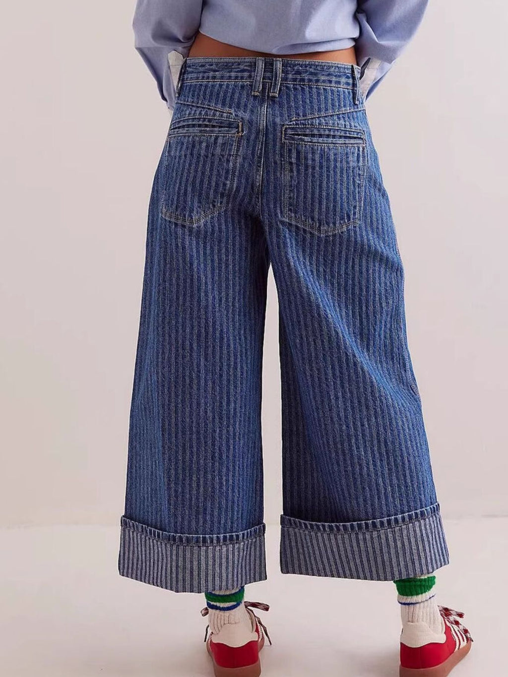Wide-leg cropped denim jeans by Plush Fashion Shop, showing relaxed fit and light blue wash on a flat lay.
