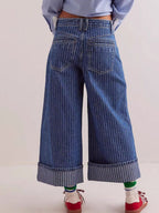 Wide-leg cropped denim jeans by Plush Fashion Shop, showing relaxed fit and light blue wash on a flat lay.