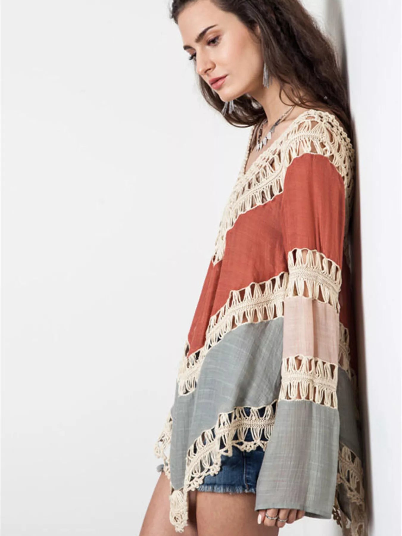 Crochet trimmed long sleeve cover-up by Trendsi featuring lightweight fabric and detailed crochet accents.