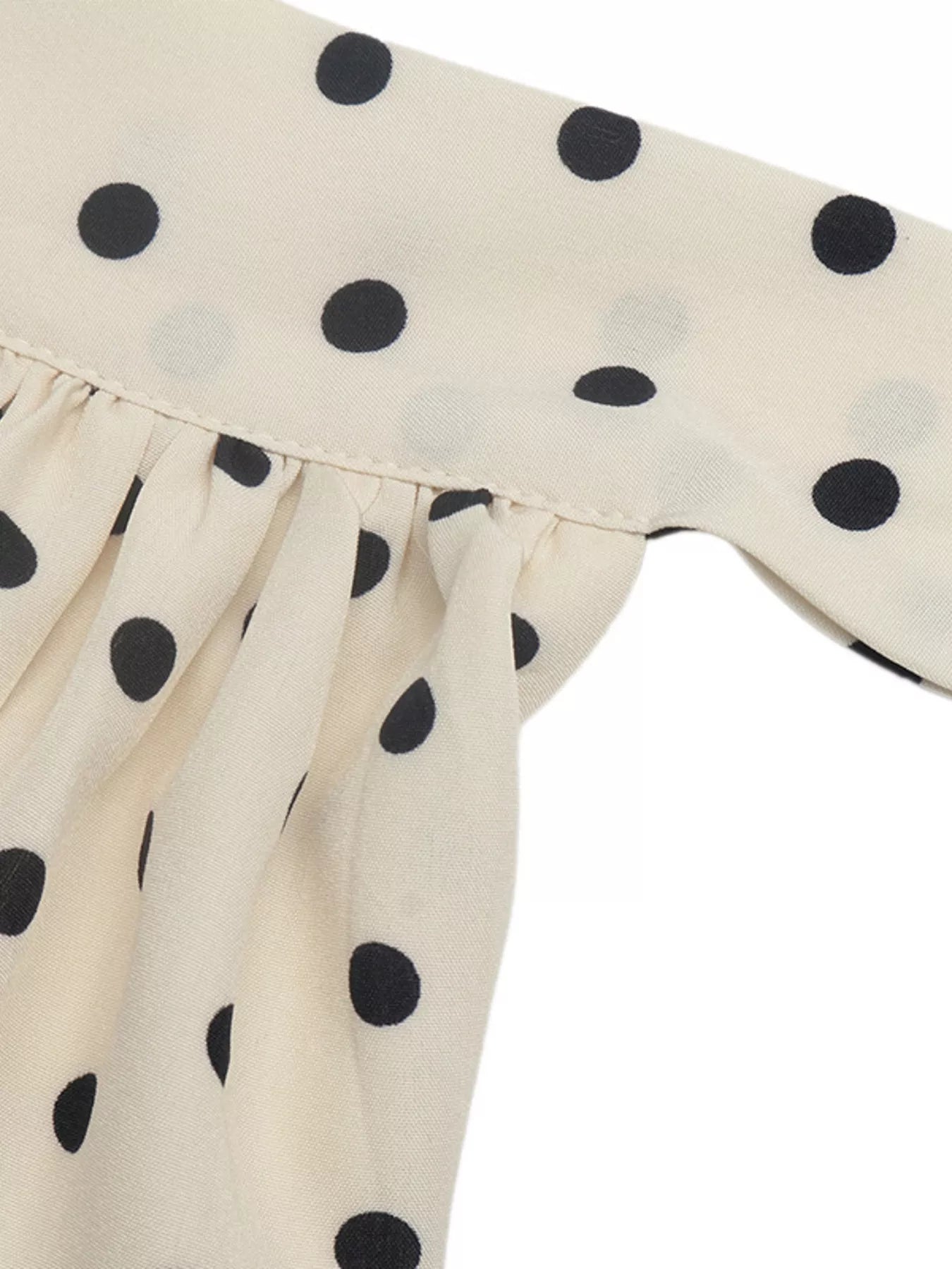 Polka dot halter neck mini dress by Trendsi featuring a fitted silhouette and stylish design.