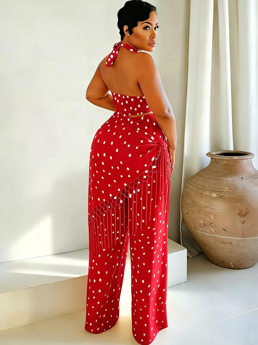 Polka dot halter neck cami and fringe trim pants set by Trendsi, featuring a stylish halter top and matching wide-leg pants.