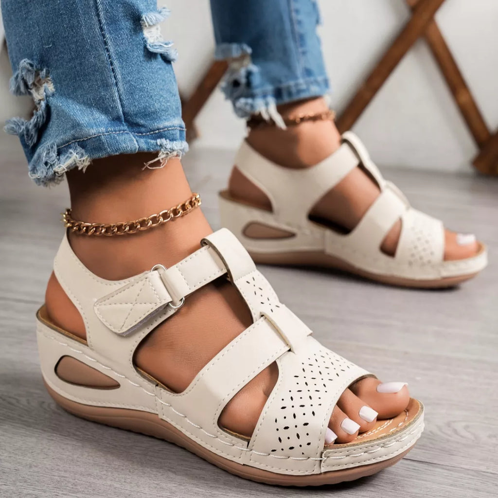 Open toe wedge sandals in neutral tones, trendy footwear by Trendsi featuring a comfortable wedge heel and stylish open toe design.