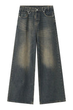 Wide leg jeans with pockets by Trendsi, showcasing a relaxed fit and classic denim style with functional front and back pockets.