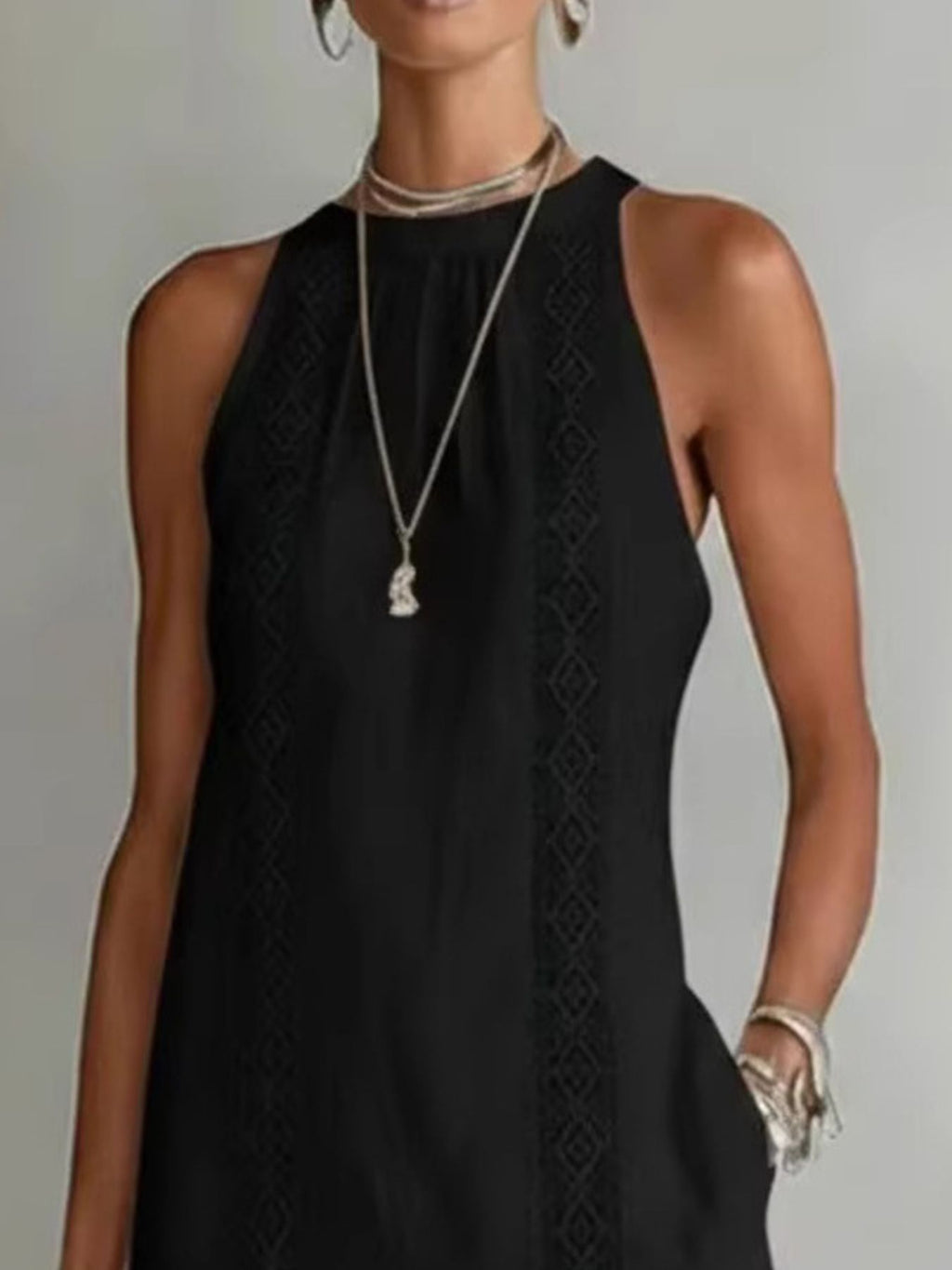 Sleeveless hollow-out midi dress with side slit and pockets, stylish Trendsi dress perfect for casual or summer wear.